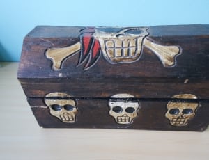 brown and white wooden skull engraved box thumbnail