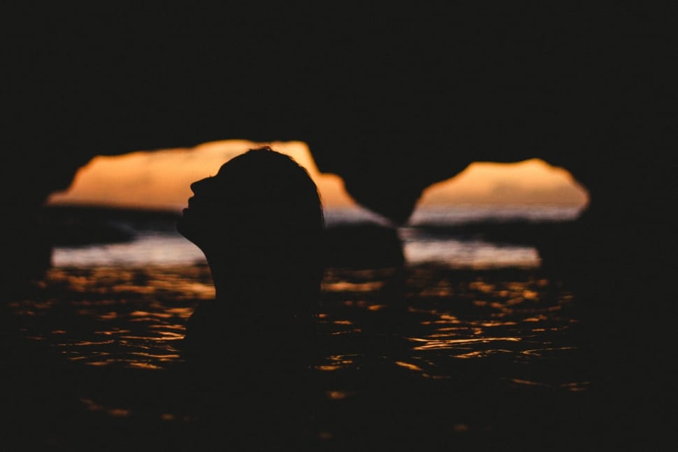 silhouette photography of woman in sea preview
