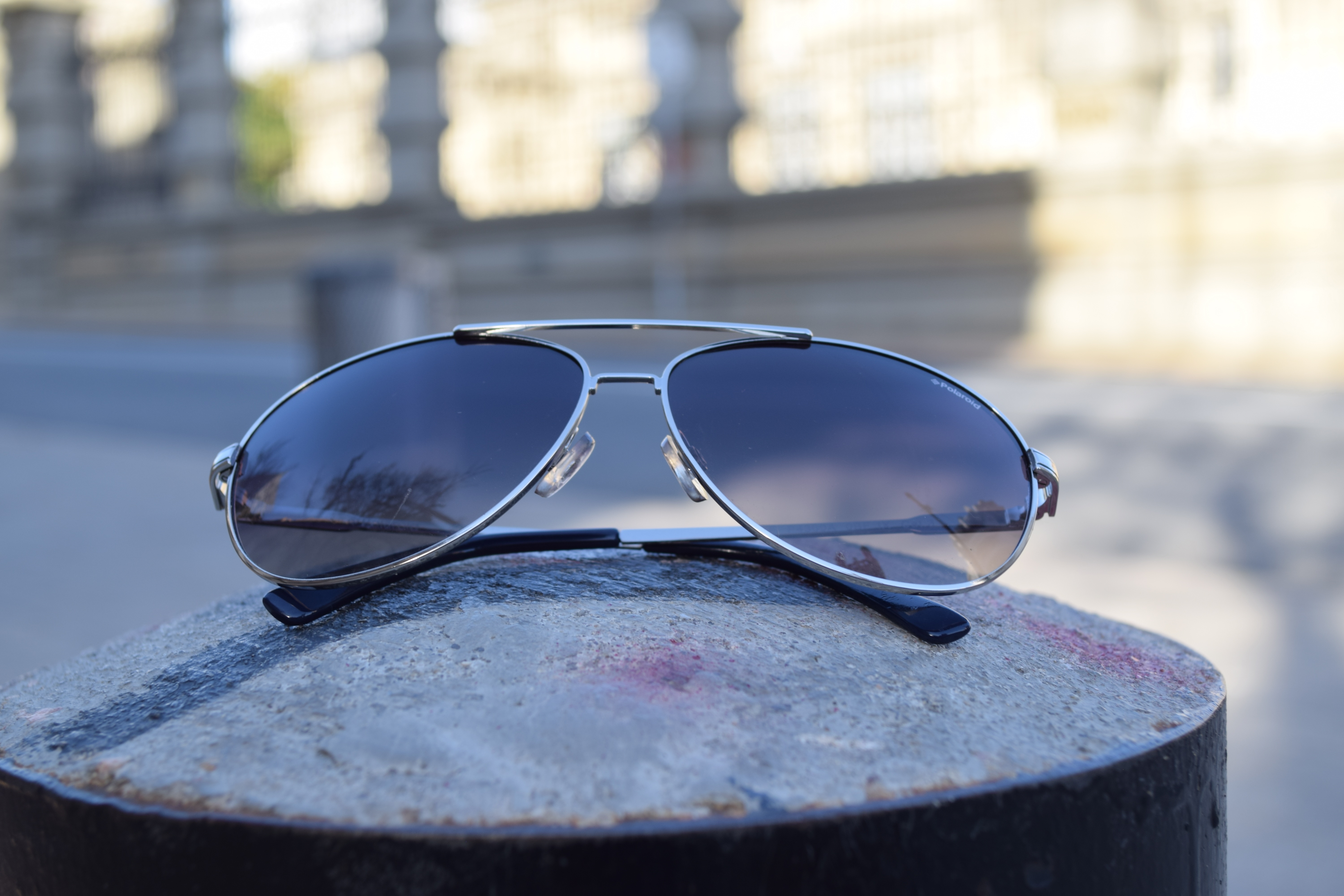gray framed aviator style sunglasses