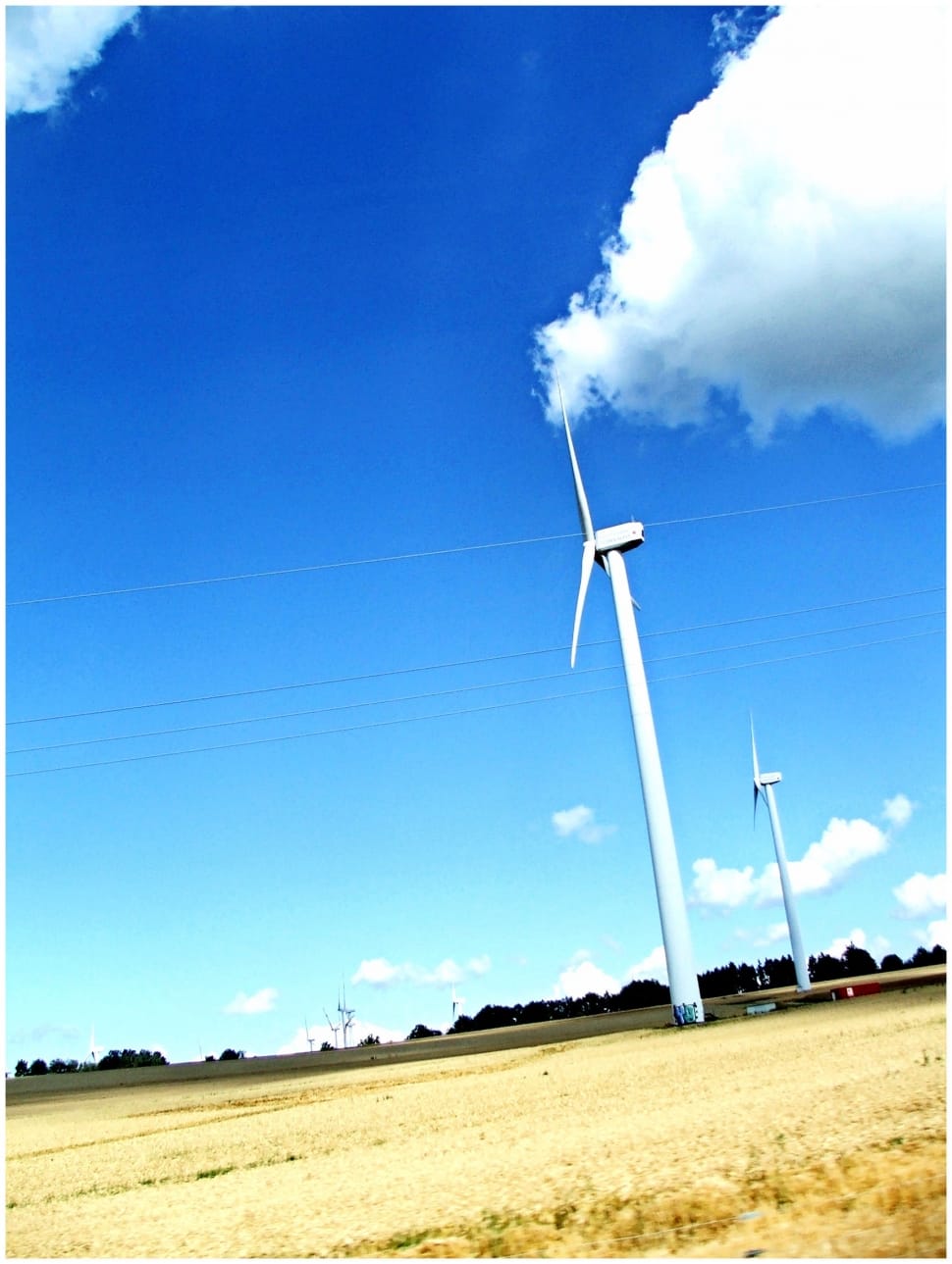 white wind mill under clear blue sky preview