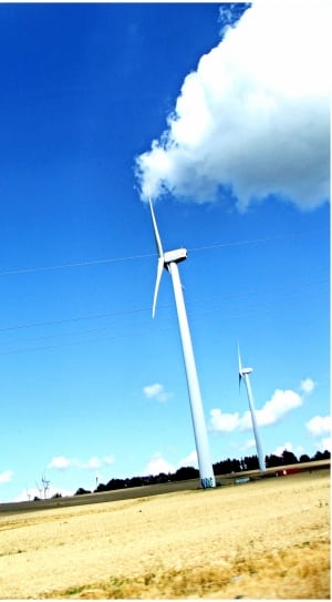 white wind mill under clear blue sky thumbnail