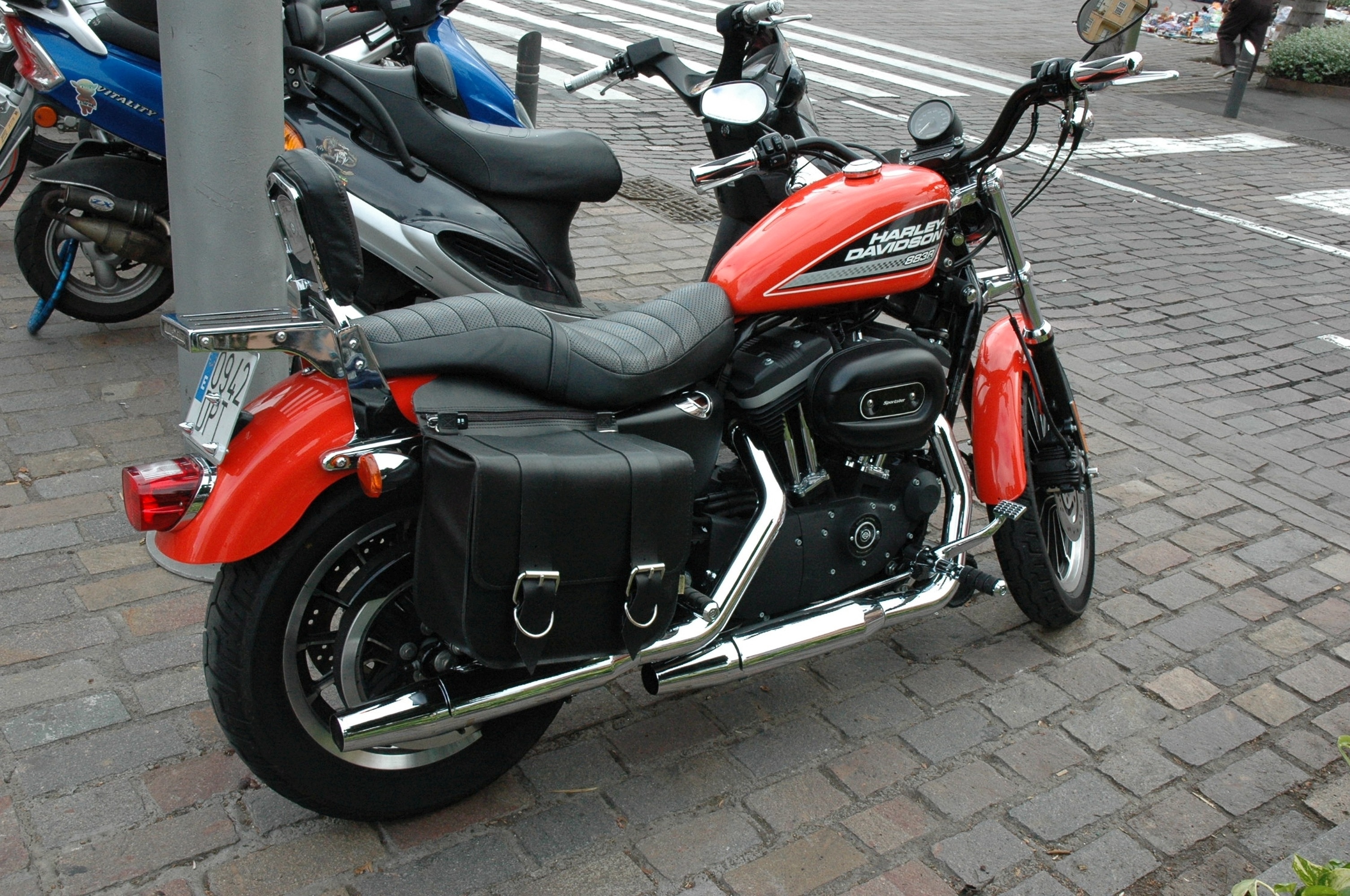 red black and stainless steel touring motorcycle