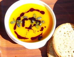 soup on white plastic bowl with bread thumbnail