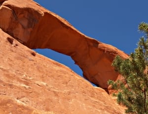 brown arch rock formation thumbnail