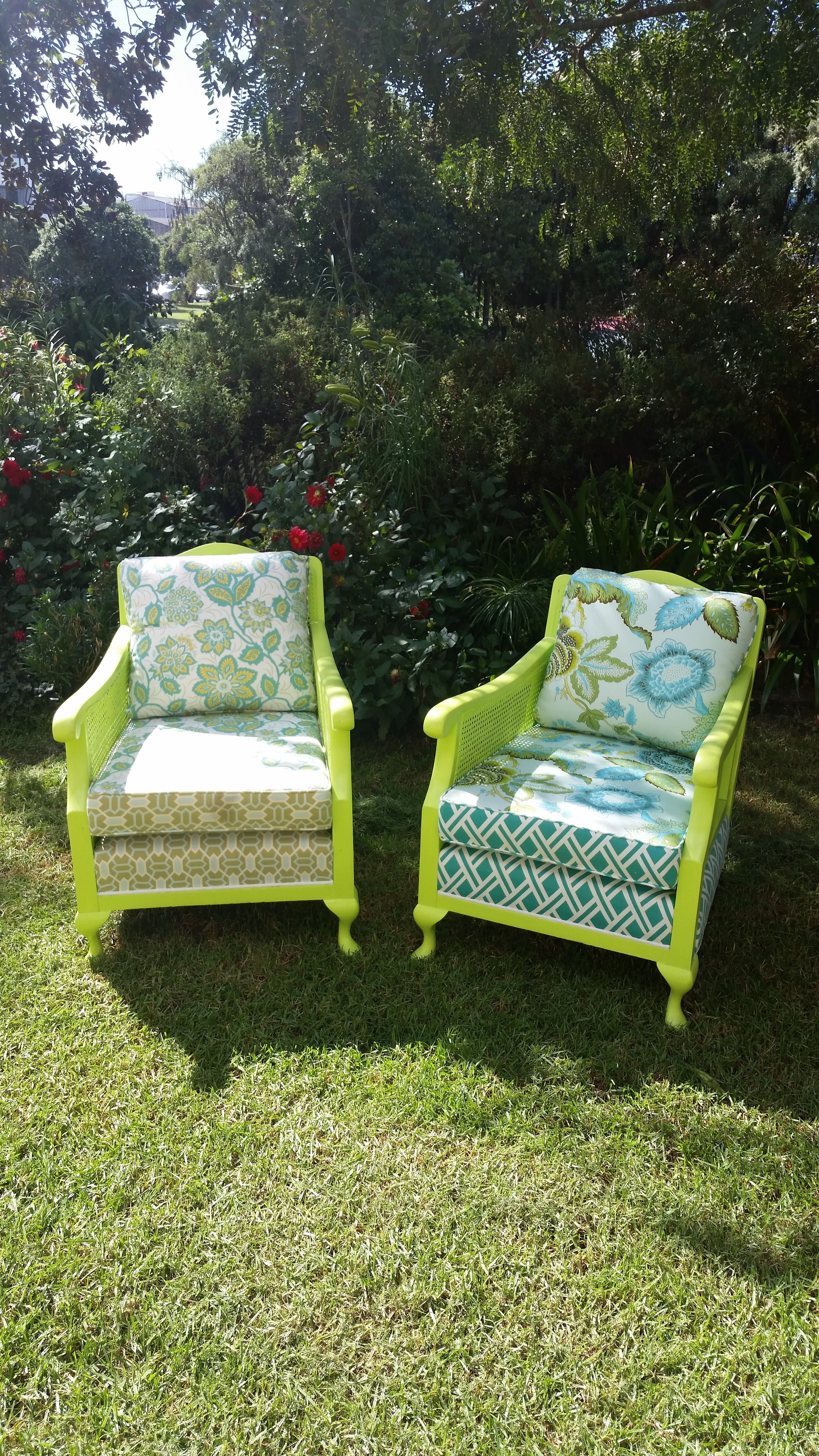 green white and blue floral padded armchair