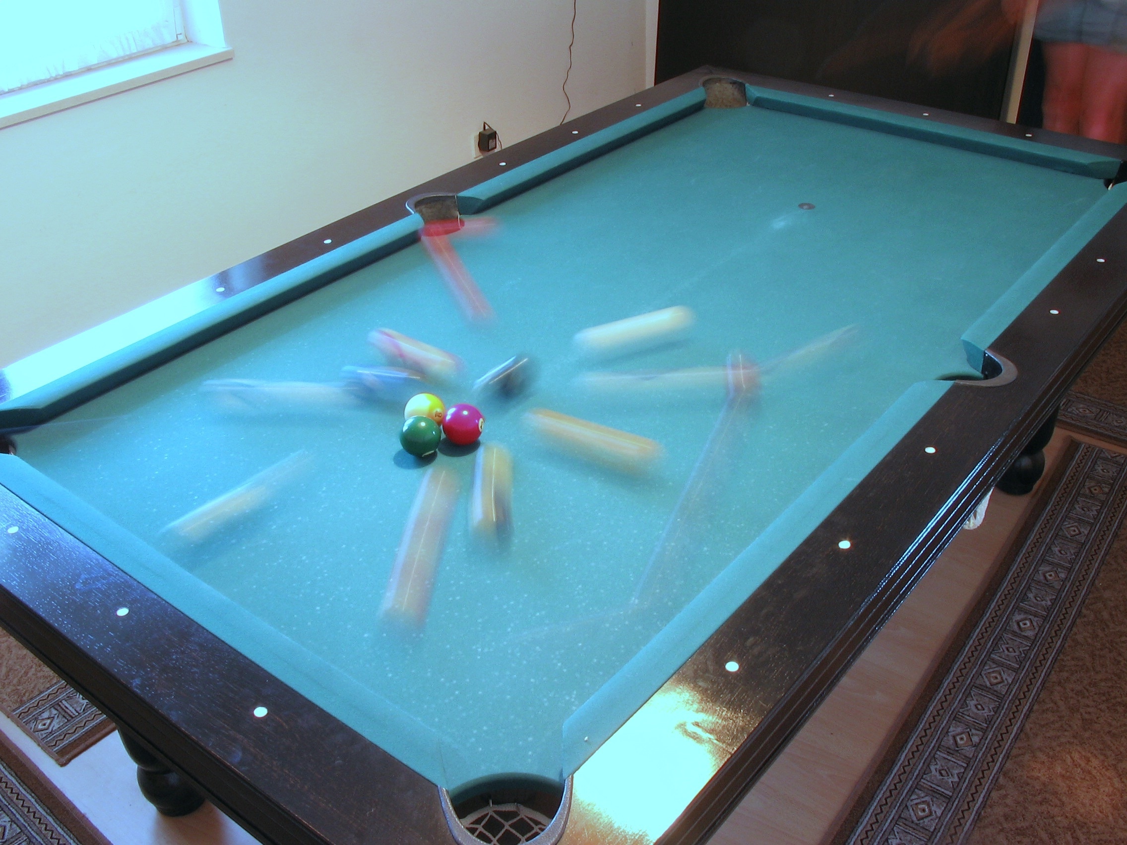 brown and green billiard table and balls