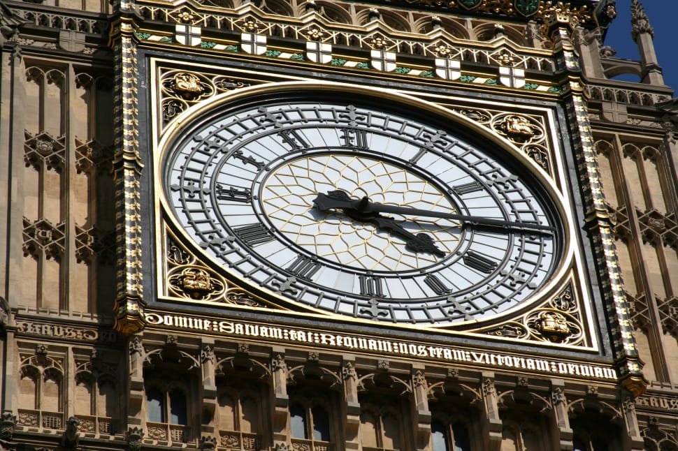 brown and white clock building preview