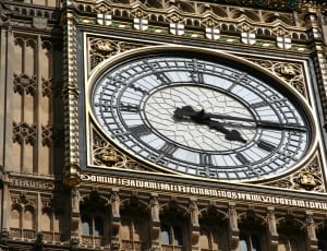 brown and white clock building thumbnail