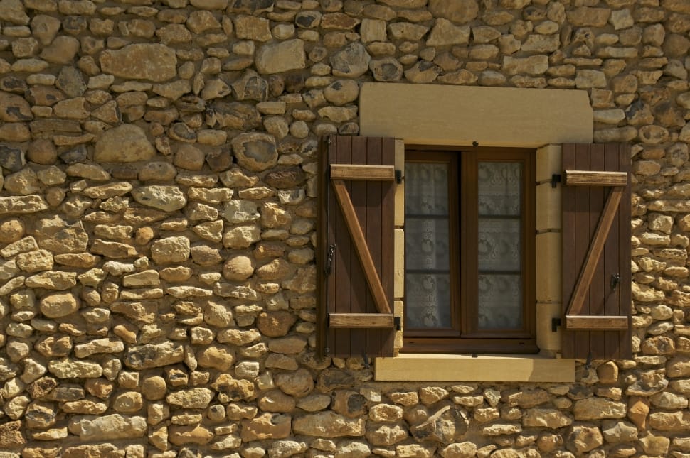 brown wooden window and stone brick wall preview