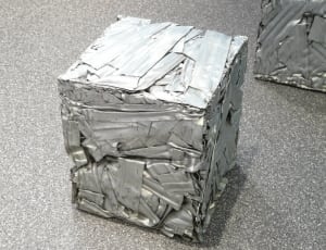 gray cuboid metal thumbnail
