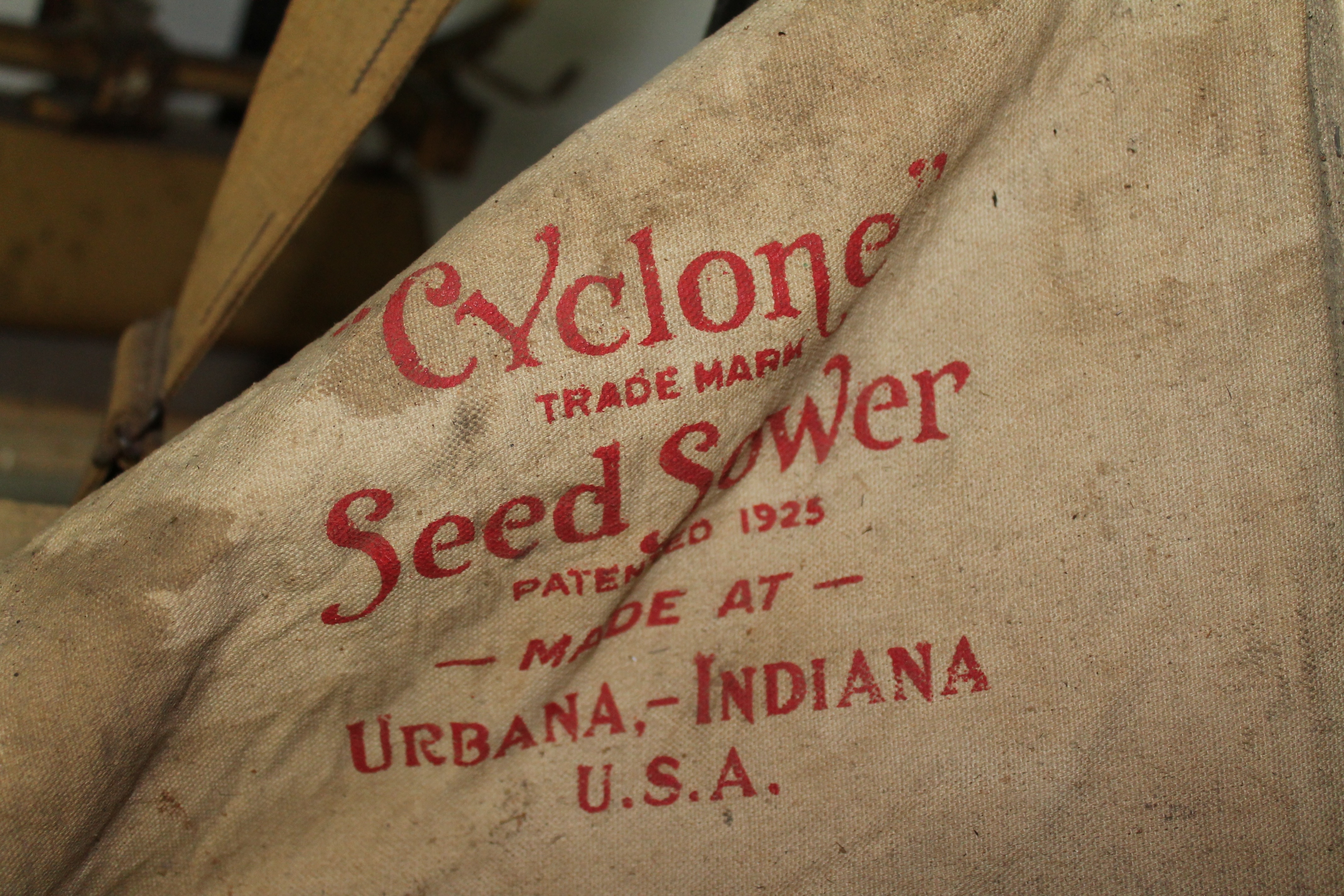 grey and red cyclone trade mark seed sower sack