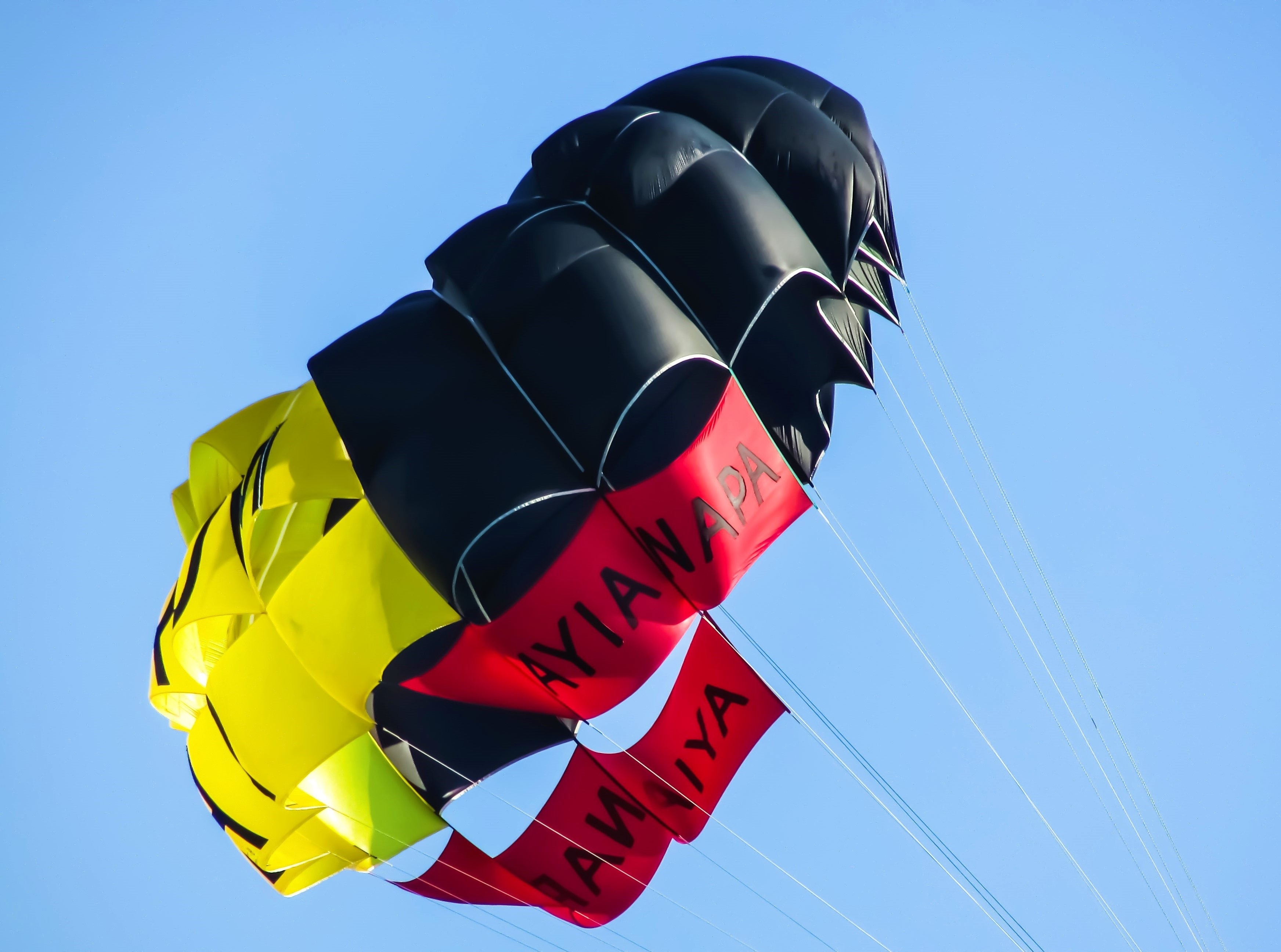 red yellow and black parachute