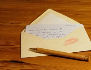 brown case pen on envelop with lip mark thumbnail