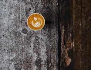 capuccino in cup on gray surface thumbnail