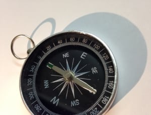 grey and black compass thumbnail