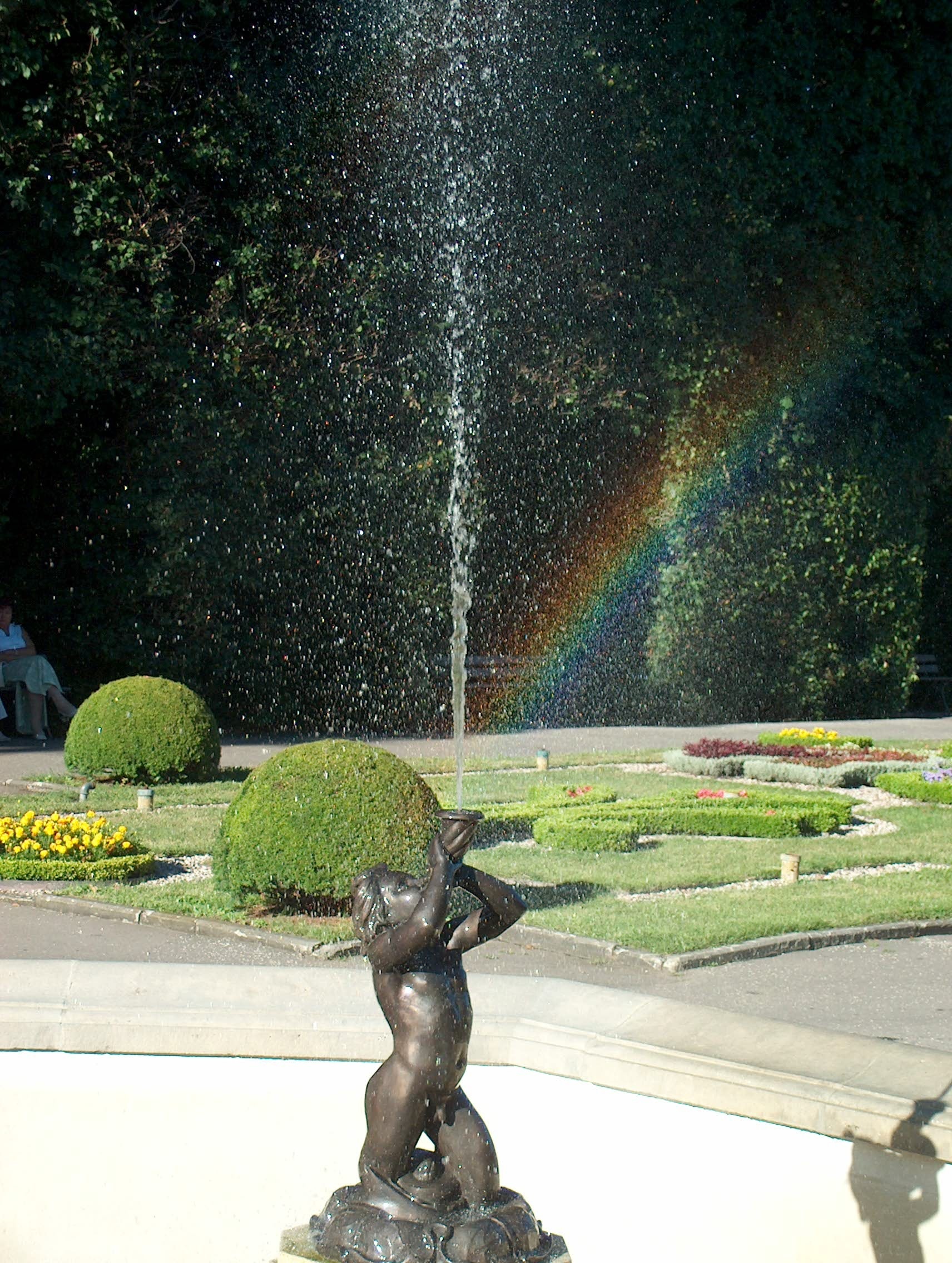 bronze man blowing horn fountain