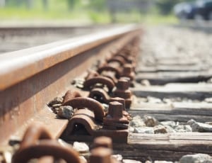 brown metal train railway thumbnail