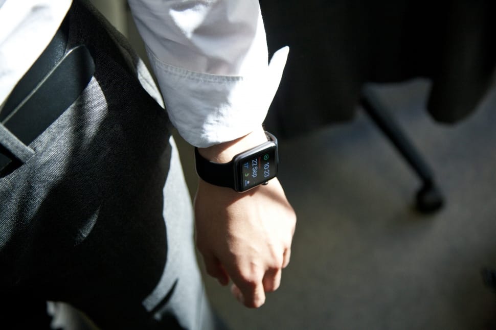 person in white dress shirt with smartwatch preview