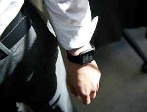 person in white dress shirt with smartwatch thumbnail