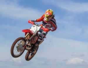 red and white off road motorcycle thumbnail