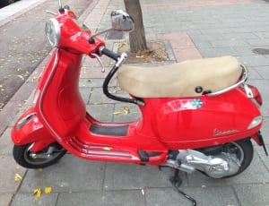 red vespa  park on the street thumbnail