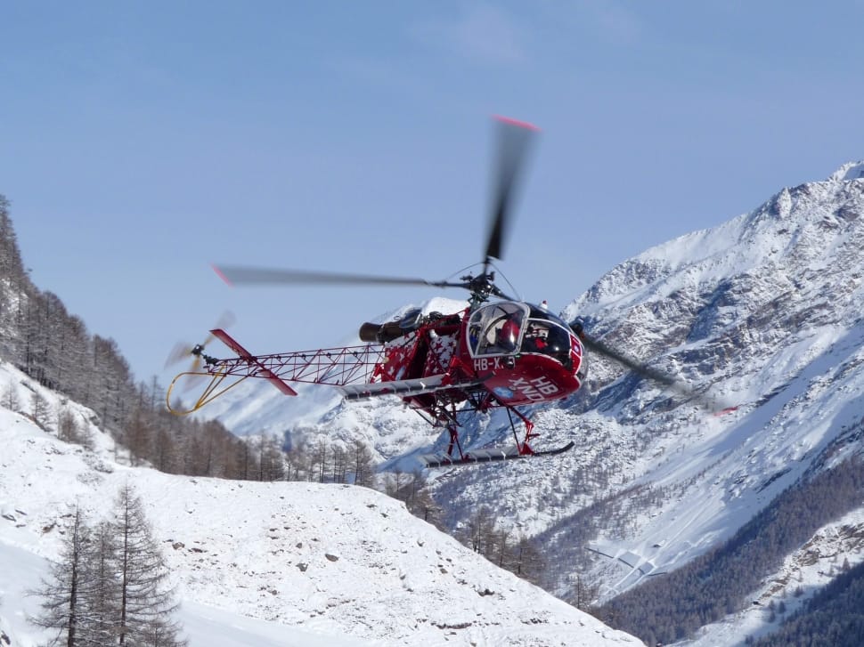 red and black helicopter near glacier mountain preview