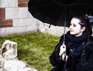 women's black coat and umbrella thumbnail