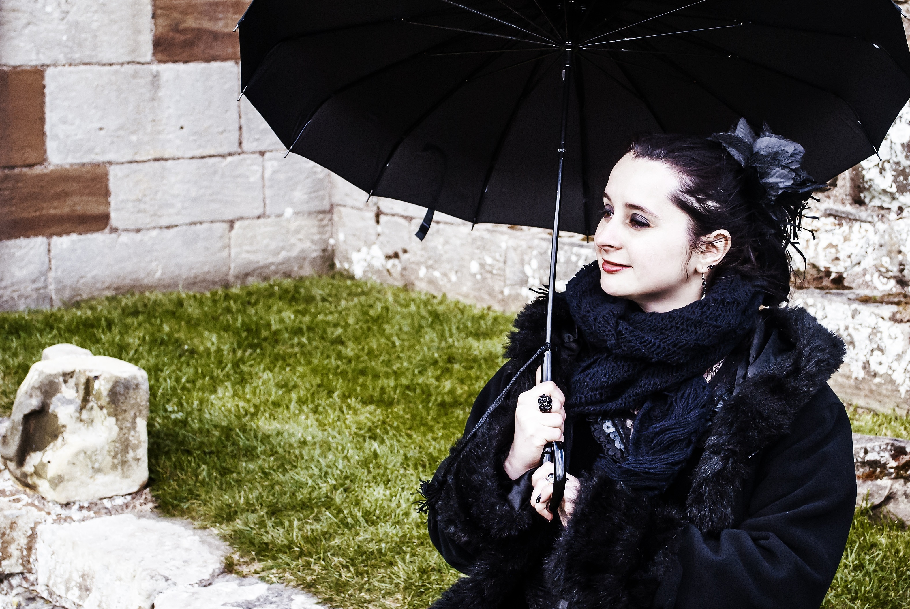 women's black coat and umbrella