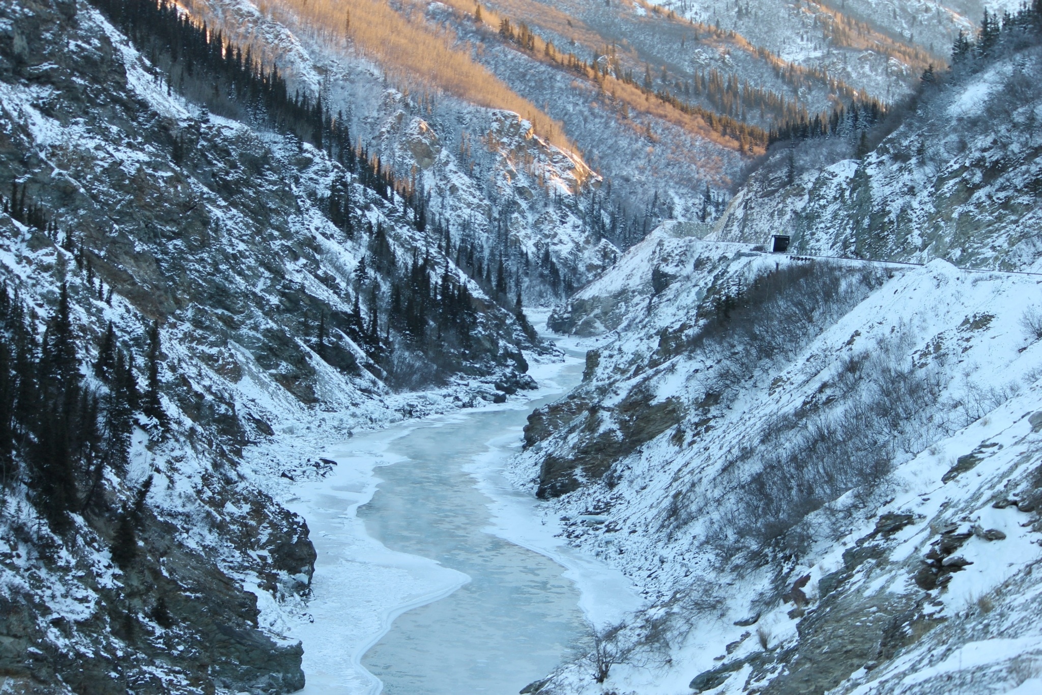 glacier mountain and river view covered with snow during daytime