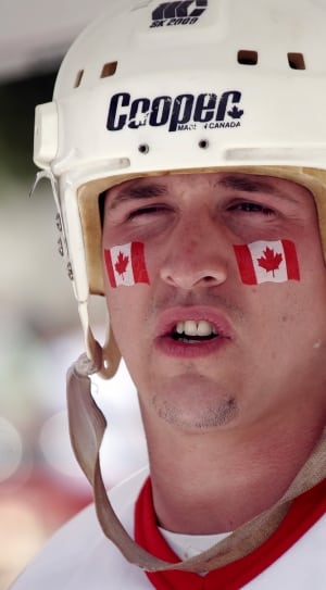 white cooper hockey helmet thumbnail