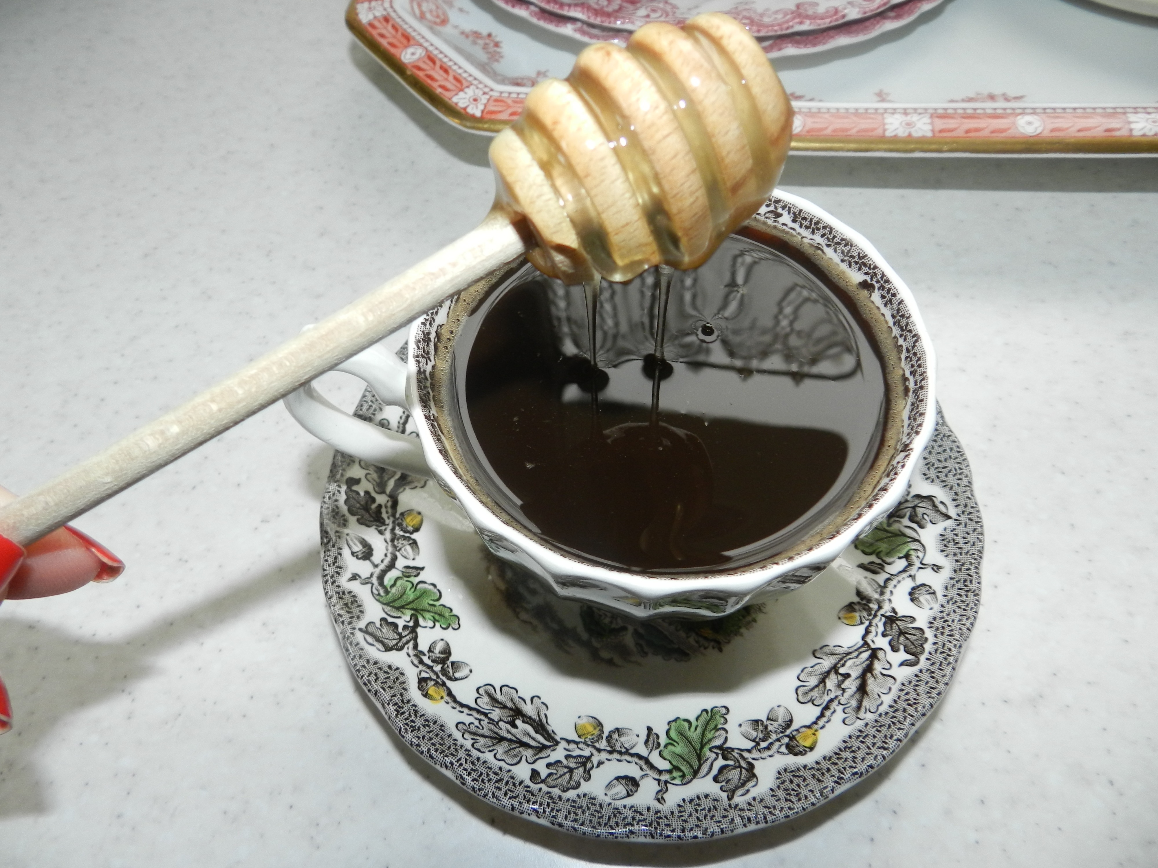 honey stick with cup and platter
