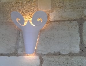 close up photo of white wall mounted lamp thumbnail