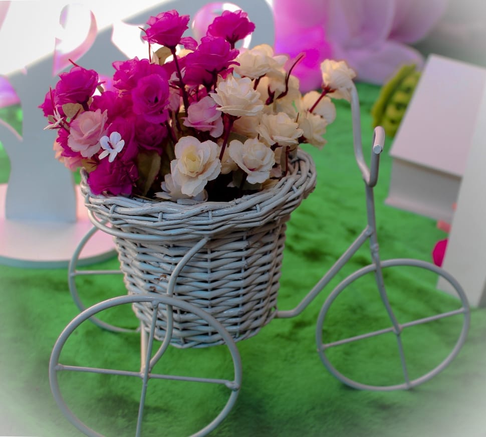 white and pink petaled flowers in wicker basket preview