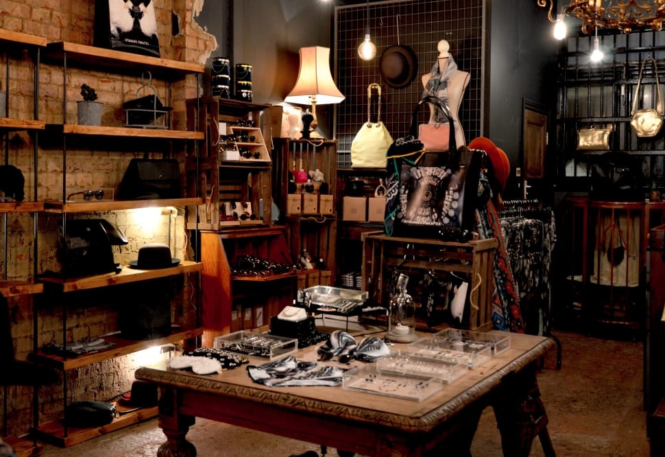 assorted items on brown wooden rack inside a room preview