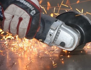 grey angle grinder cutting metal thumbnail