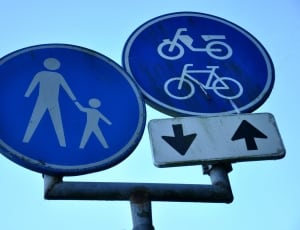 blue and white metal road signage during daytime thumbnail