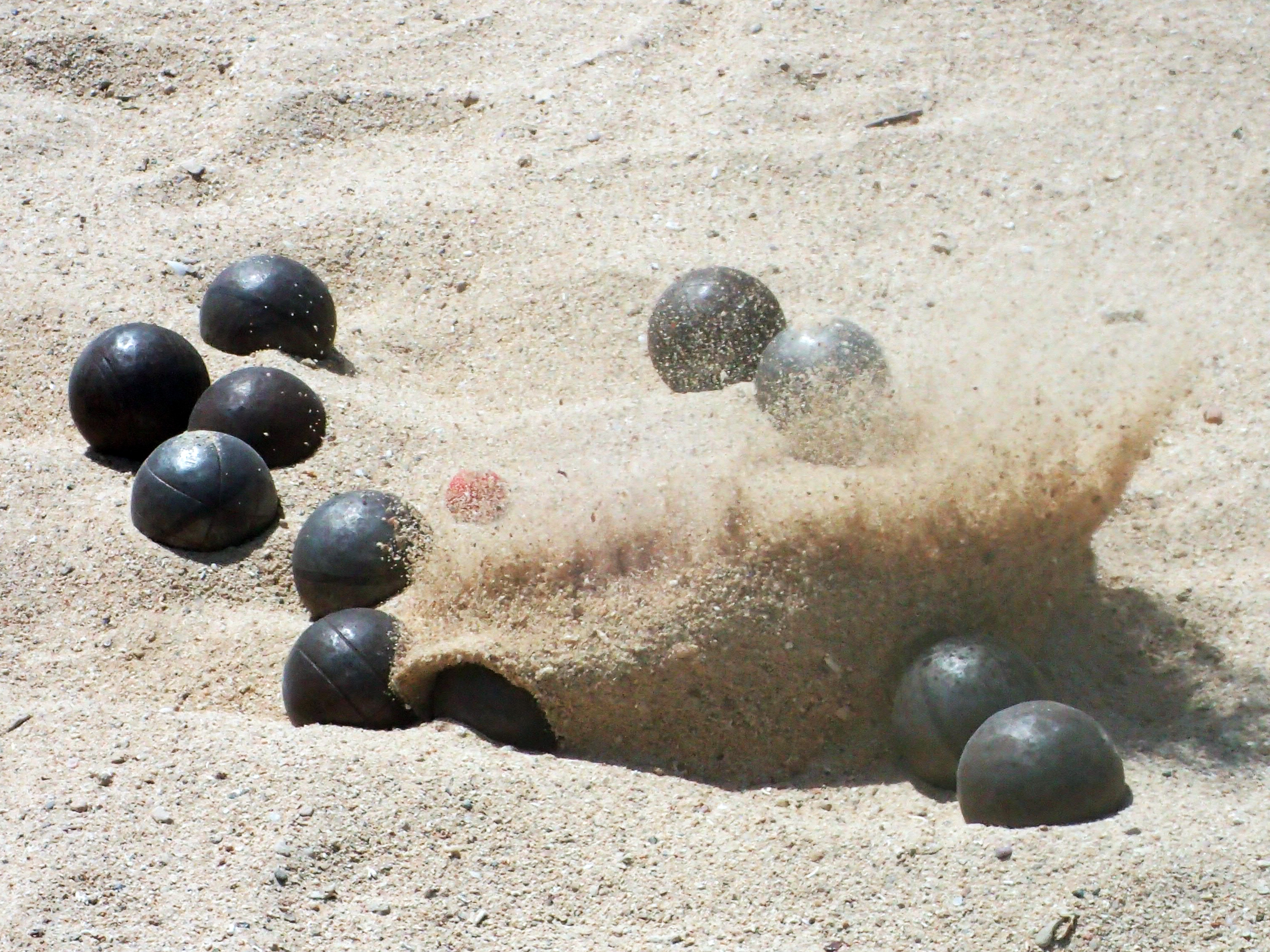 black ball lot and gray sand