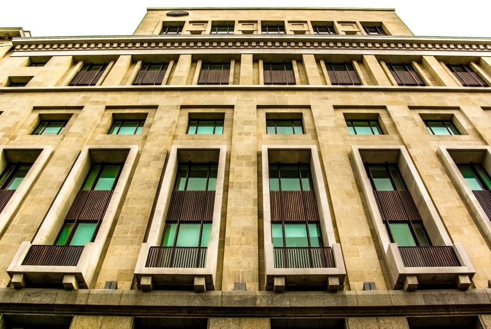 worm's eye view of yellow and brown concrete building preview