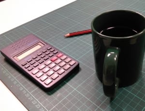 green ceramic mug and calculator thumbnail