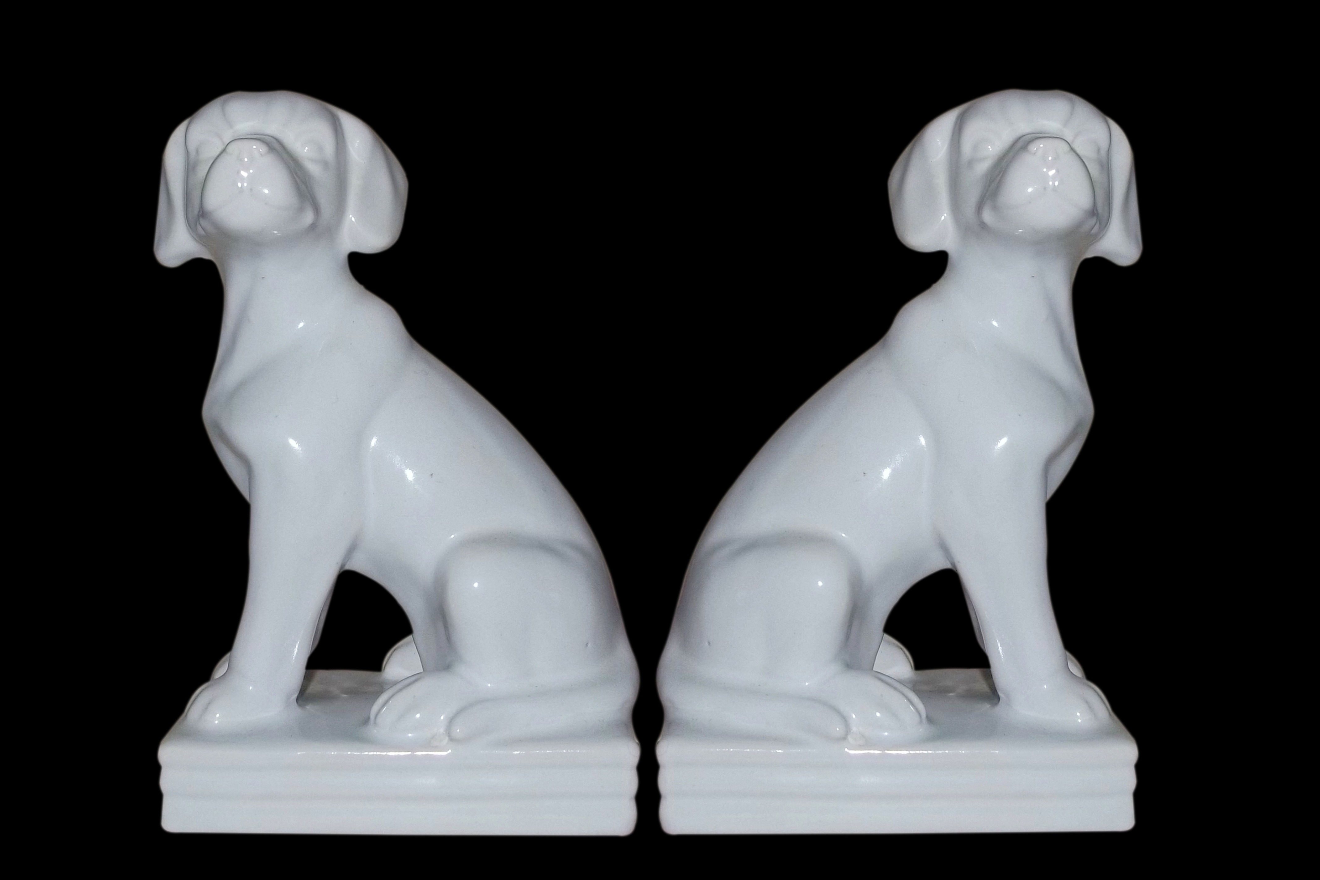 2 white dog ceramic figurines