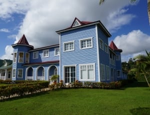 blue white and brown wooden 2 story house thumbnail
