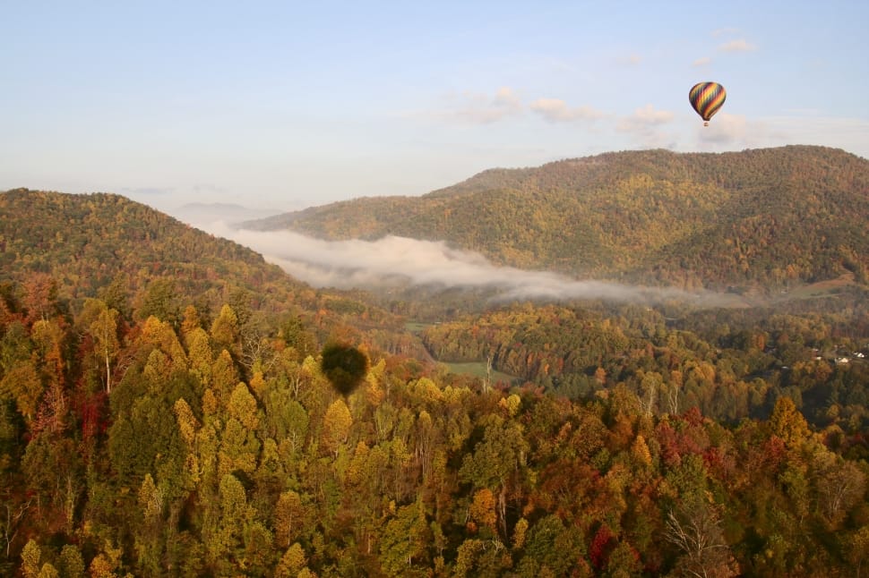 hot air balloon over grassy mountain preview
