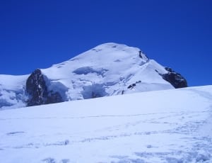 snow on mountain during daytime thumbnail