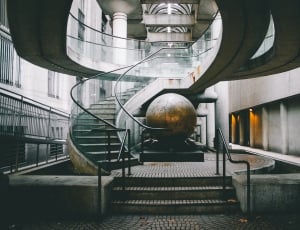 black metal staircase with globe inside thumbnail