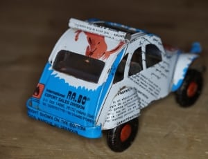 white and blue toy sedan thumbnail