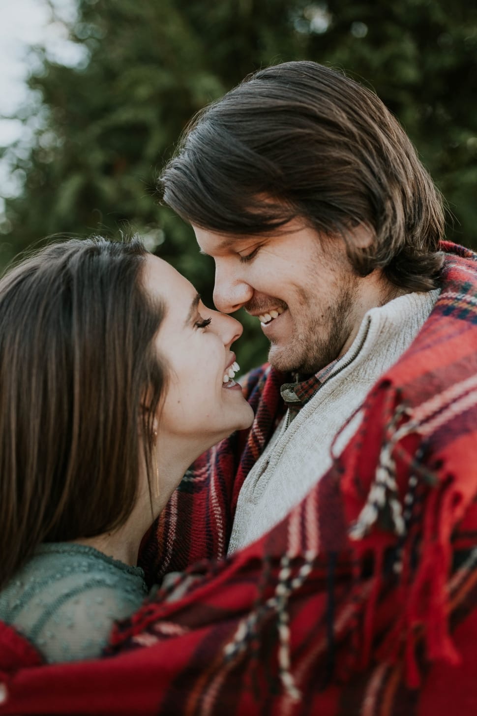 woman and man facing each other while smiling preview