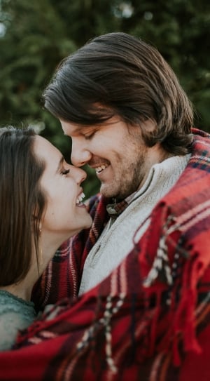woman and man facing each other while smiling thumbnail