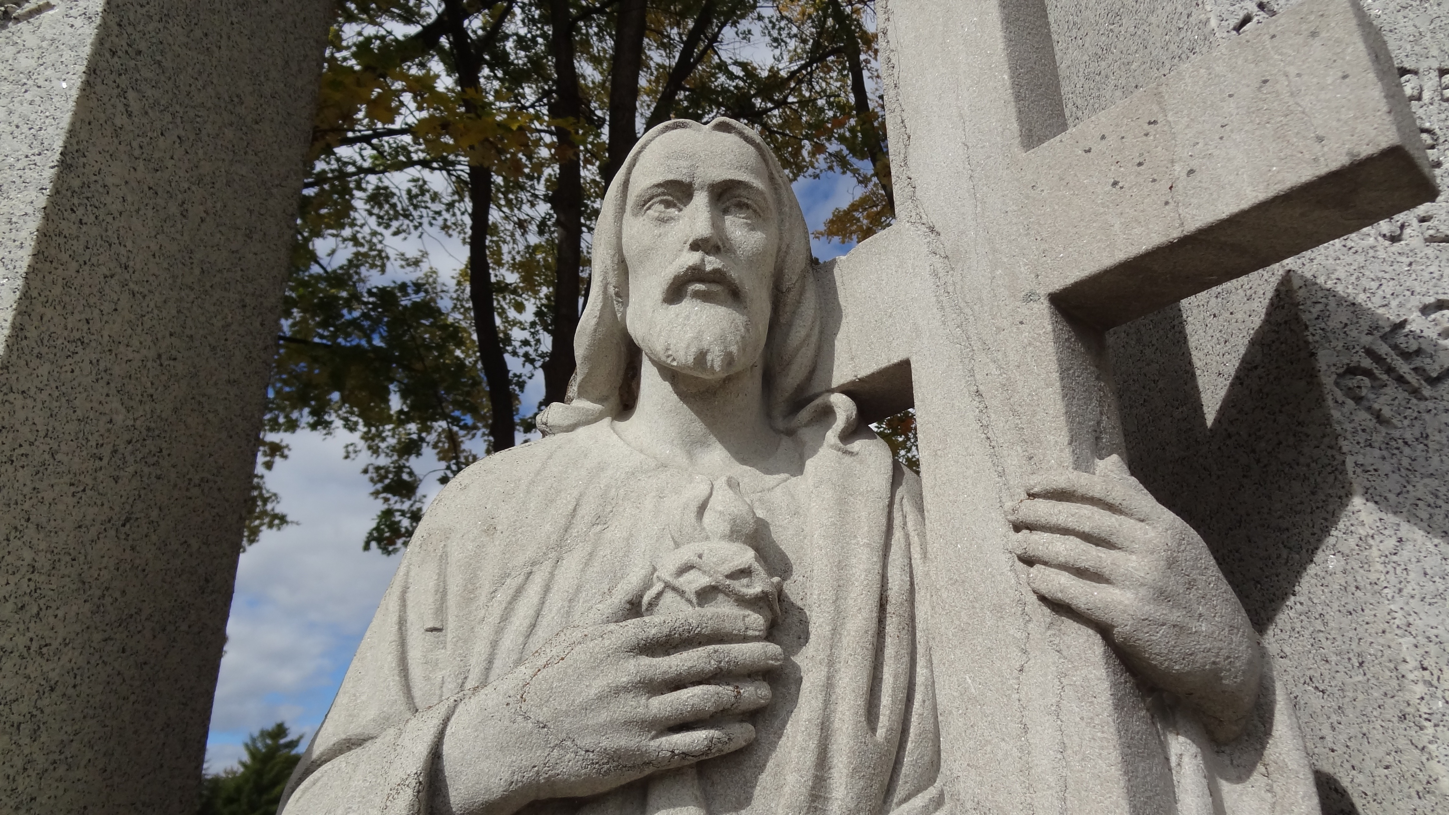 jessus christ with cross concrete statue