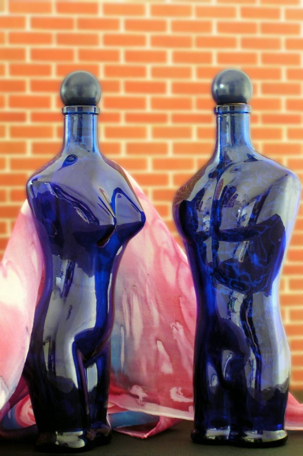 2 blue glass torso bottles preview