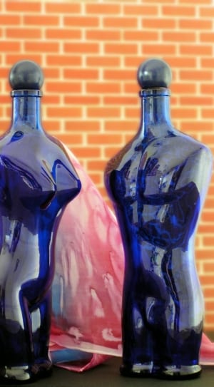 2 blue glass torso bottles thumbnail